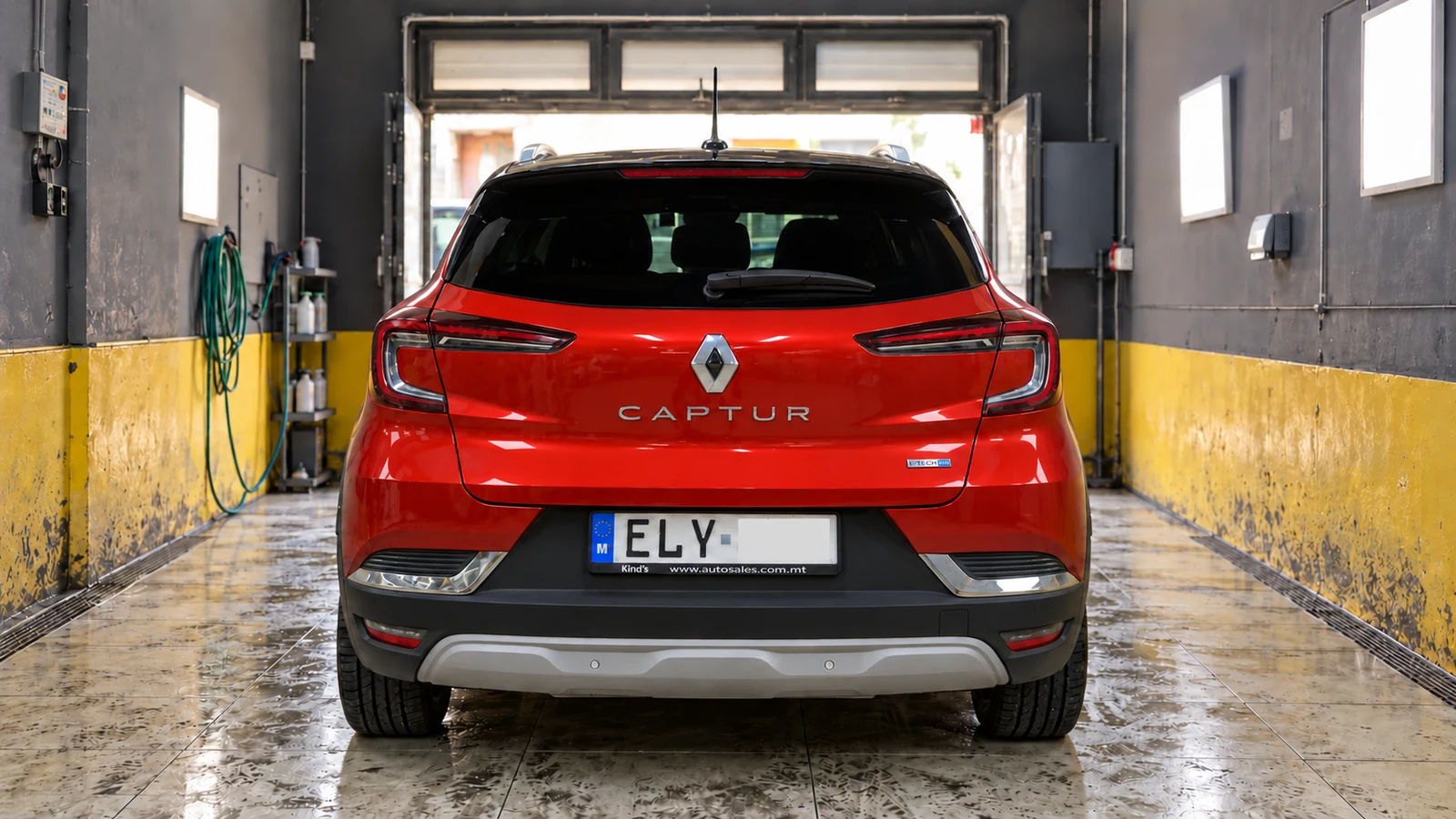 Red Renault Captur after detailing, with clean glass and glossy paint